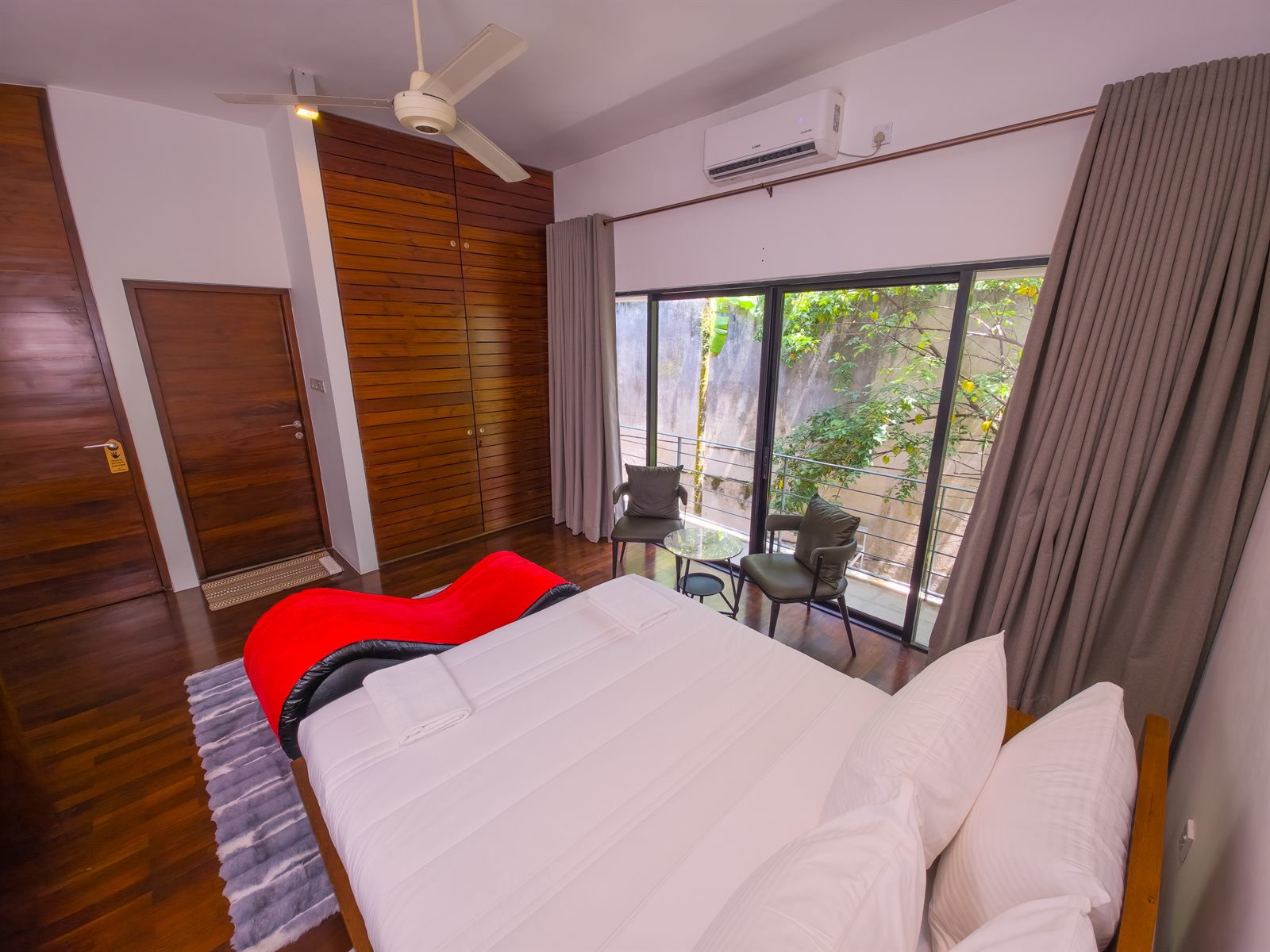 Superior Room bed and balcony seating from above