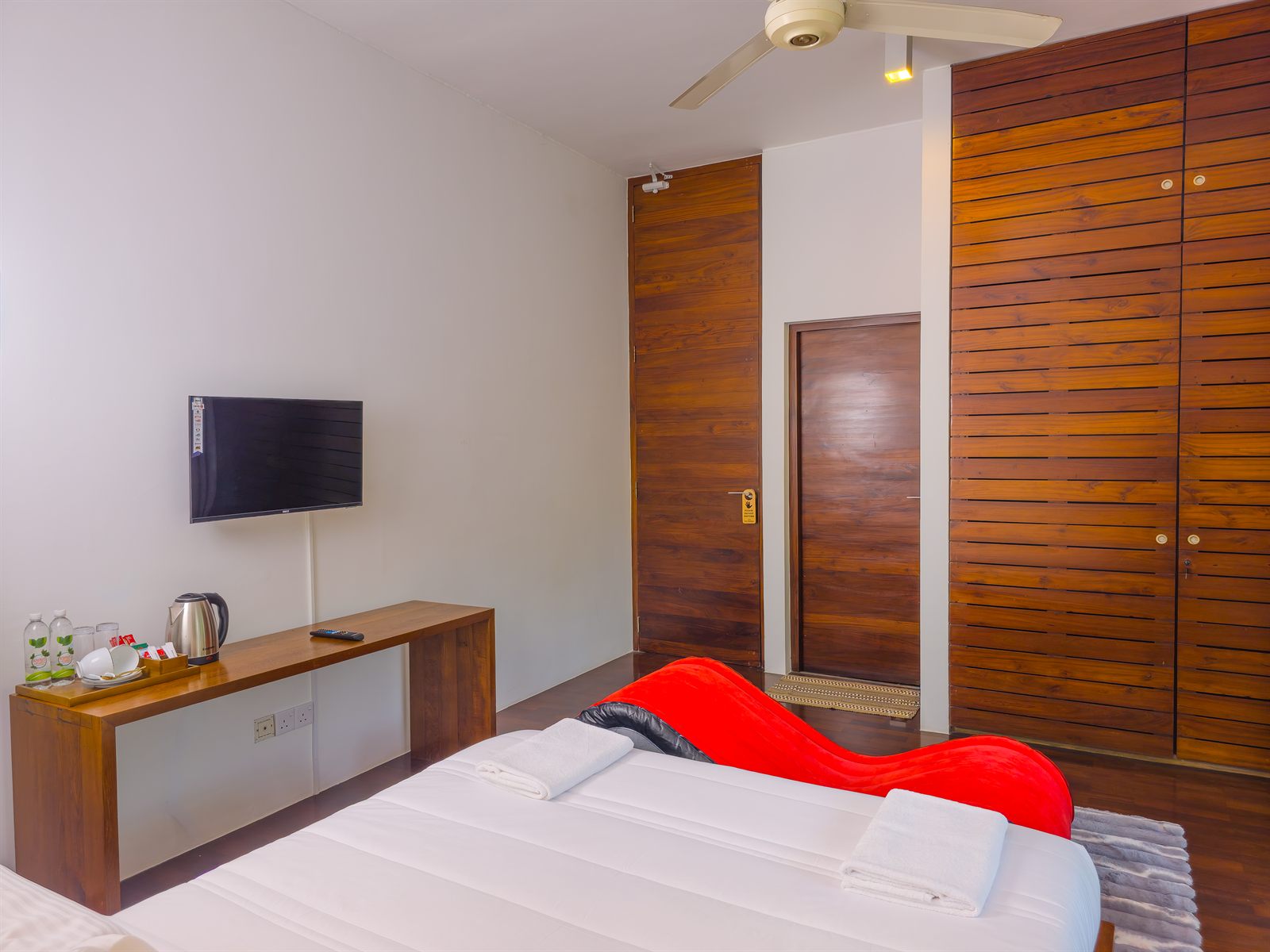 Superior Room TV, wooden desk, and wardrobe